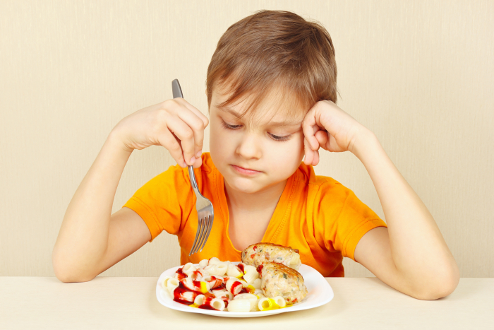 Boy not wanting to eat lunch